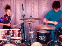 Watch Matt Helders and Nandi Bushell rip through Arctic Monkeys’ ‘Brianstorm’ on drums