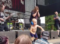 Watch a toddler storm the stage at an extreme metal festival